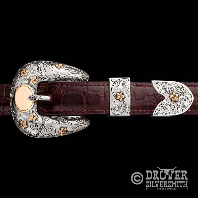A sterling silver three piece belt buckle set 