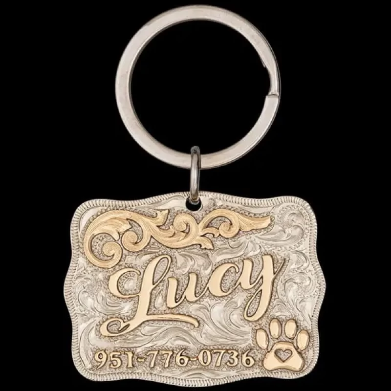 A customizable pet tag in a silver hand engraved base