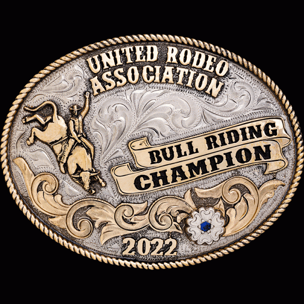 The Boulder Custom Belt Buckle has a German Silver base with a classic rope edge border and hand engraved jewelers bronze floral details. Customize this design today!