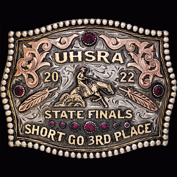 The Richfield Custom Belt Buckle features a silver bead edge with copper scrollwork and 2D feathers and bronze lettering. Customize this buckle for your rodeo event today!