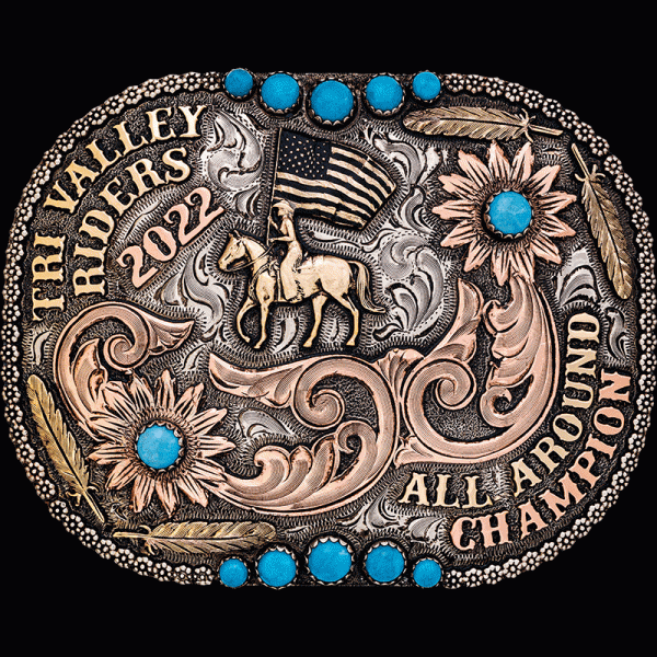 The Santa Cruz Custom Belt Buckle is an antiqued german silver buckle with berry beads, copper scrollwork, bronze 2d feathers and 12 Turquoise stones. Customize it now!
