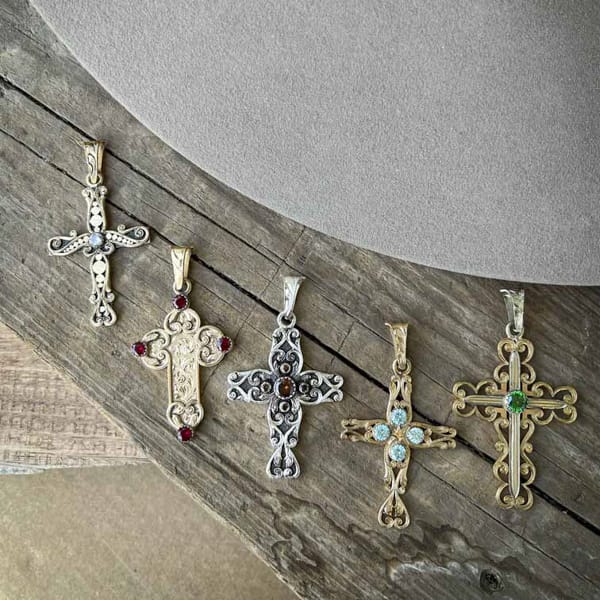 A collection of golden cross pendants