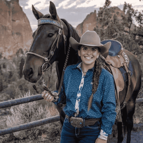 Cowgirl wit her horse and a western belt buckle